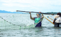 Women fishing a few meters away from the Dawasamu river mouth, in Fiji
